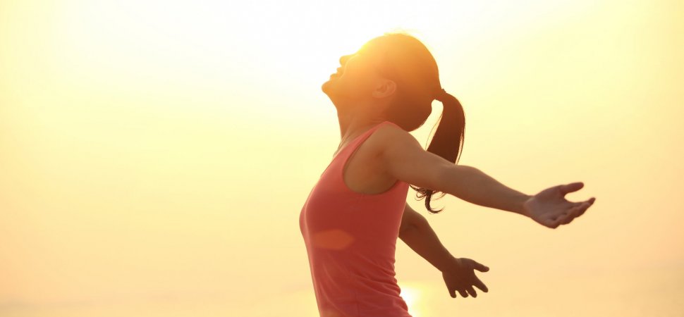 A woman enjoying the sunrise in the morning